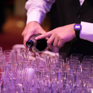 server pouring champagne