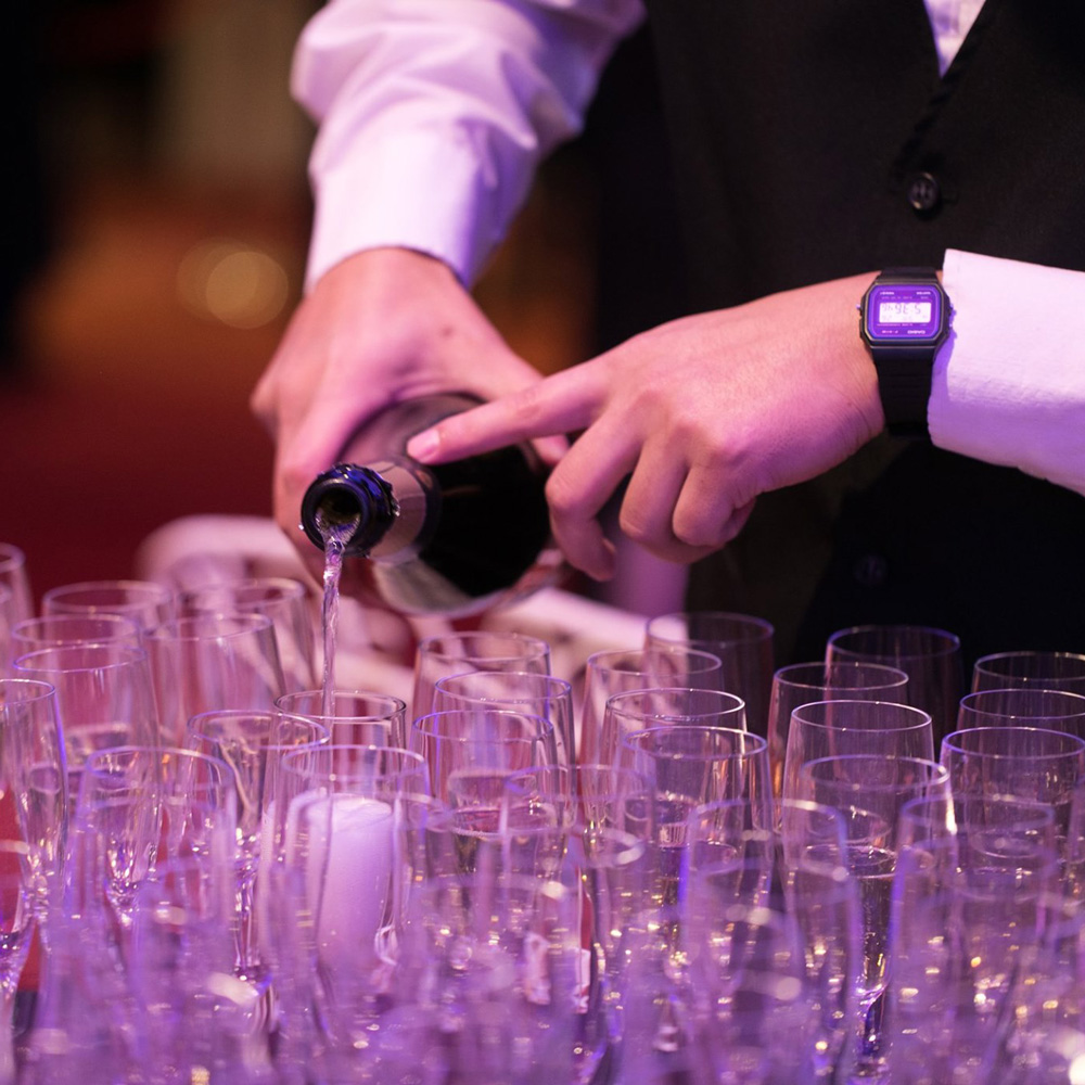 server pouring champagne