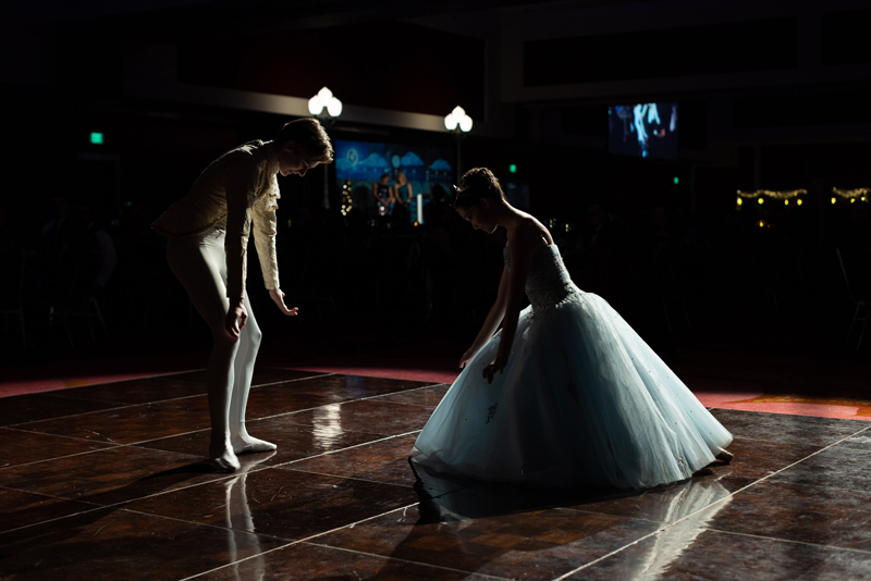 Two dancers from the ballet face and bow towards each other before their choreographed routine begins